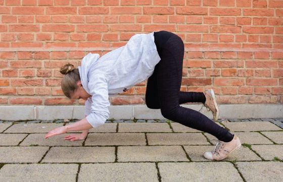 Female athlete progression into a roll transition